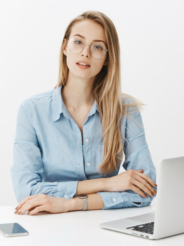 cropped successful female entrepreneur blue collar shirt